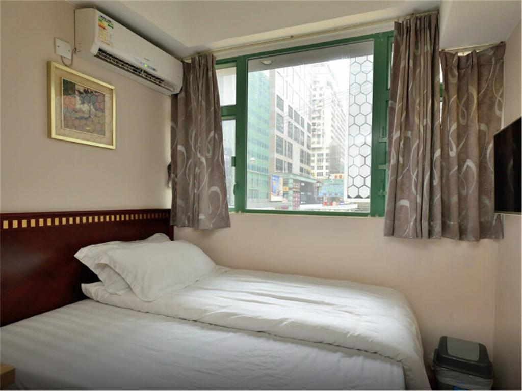 Mingdu Hostel Цзюлун Экстерьер фото