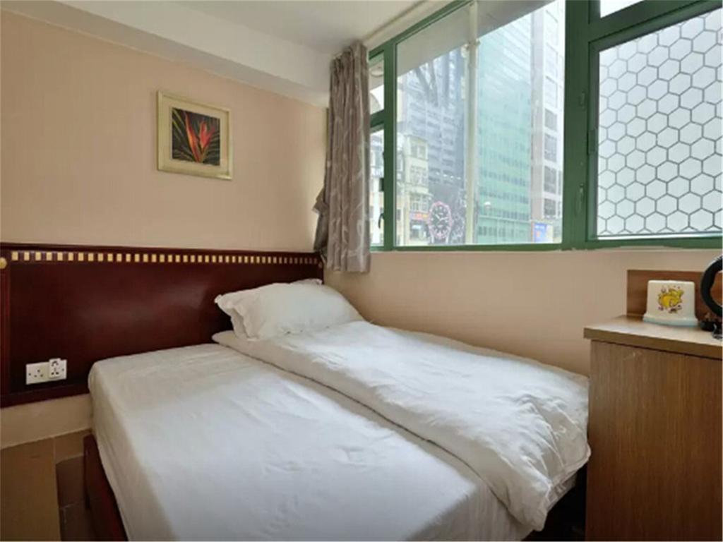 Mingdu Hostel Цзюлун Экстерьер фото