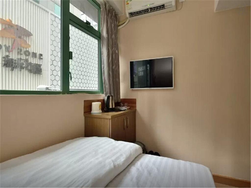Mingdu Hostel Цзюлун Экстерьер фото