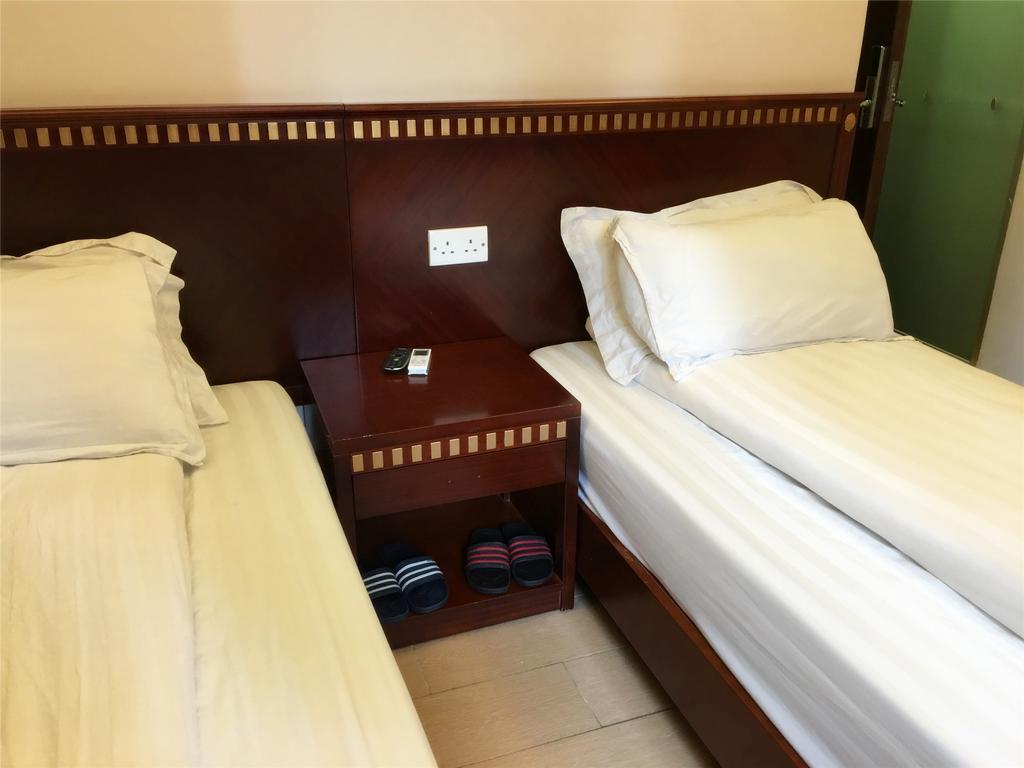 Mingdu Hostel Цзюлун Экстерьер фото