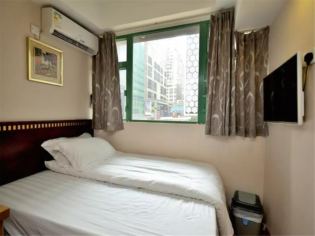 Mingdu Hostel Цзюлун Экстерьер фото