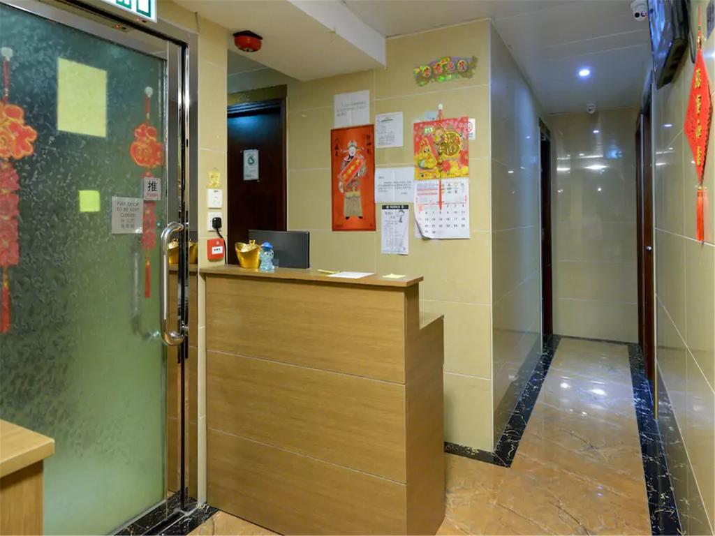 Mingdu Hostel Цзюлун Экстерьер фото