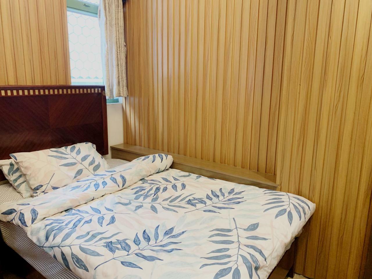 Mingdu Hostel Цзюлун Экстерьер фото