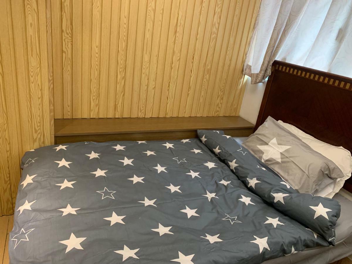 Mingdu Hostel Цзюлун Экстерьер фото