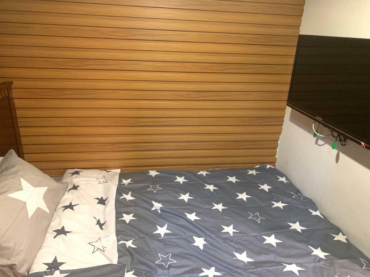 Mingdu Hostel Цзюлун Экстерьер фото