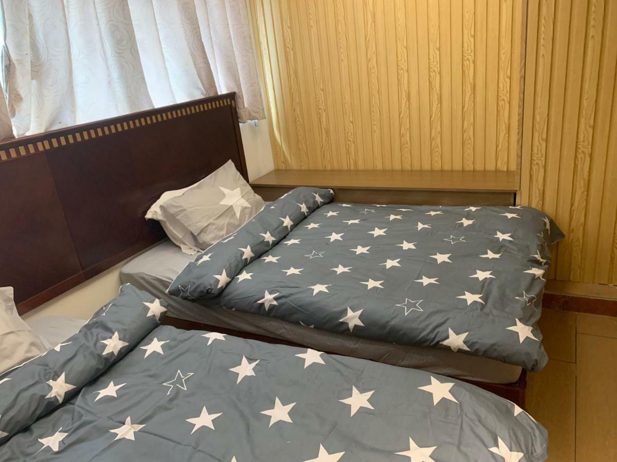 Mingdu Hostel Цзюлун Экстерьер фото